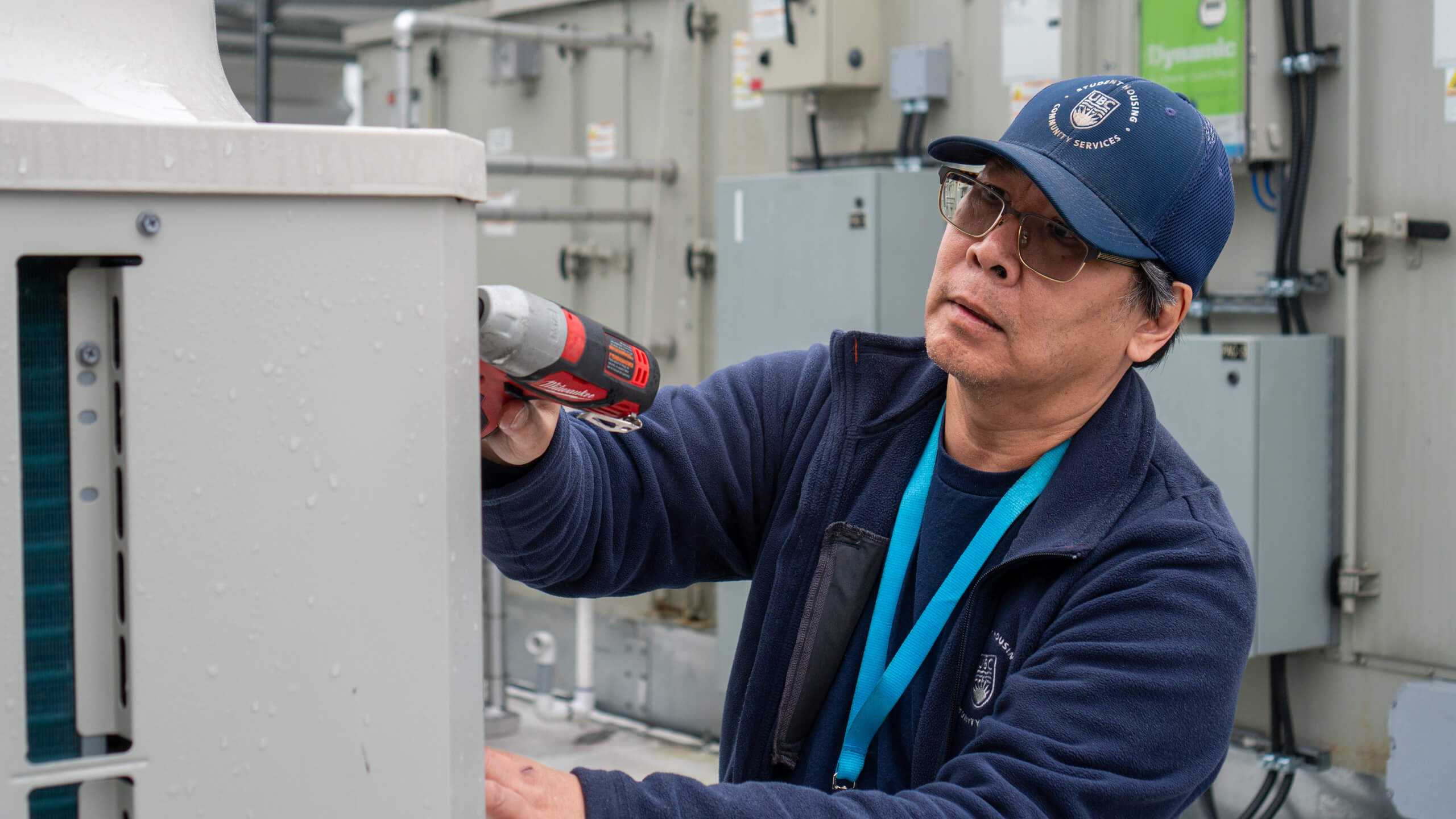 Lyle Cheng, Refrigeration Tehnician, SHCS, servicing the HVAC system on the q̓əlɬaləməcən leləm̓ (Orca House) rooftop